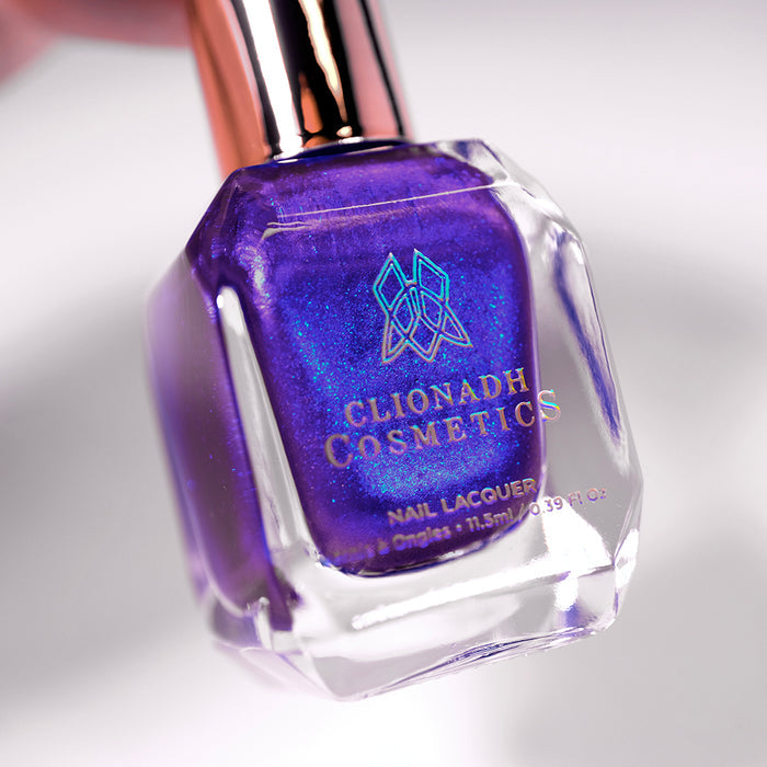 Angled, close-up of Tiara Nail Lacquer bottle on a white background.