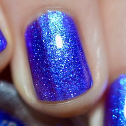 Close-up of one nail painted with Tiara Nail Lacquer on fair skin tone.