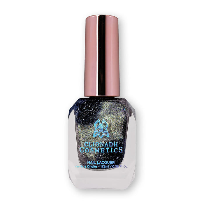 Bottle of nail polish containing Tombstone Nail Lacquer on white background.