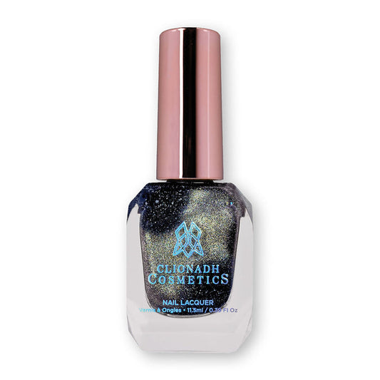 Bottle of nail polish containing Tombstone Nail Lacquer on white background.