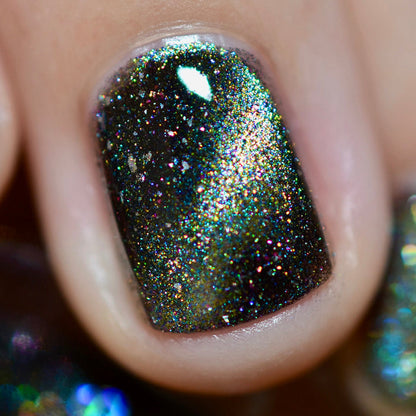 Close-up of one nail painted with Tombstone Nail Lacquer on fair skin tone.