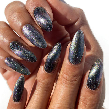 Nails painted with Tombstone Nail Lacquer on medium skin tone.