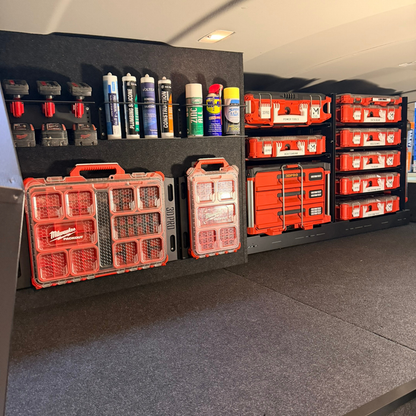 Storage area with red toolboxes and supplies on a gray false floor.