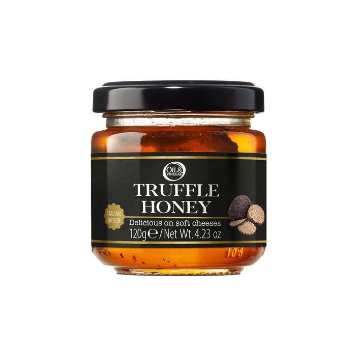 Jar of truffle honey with a black label on a white background