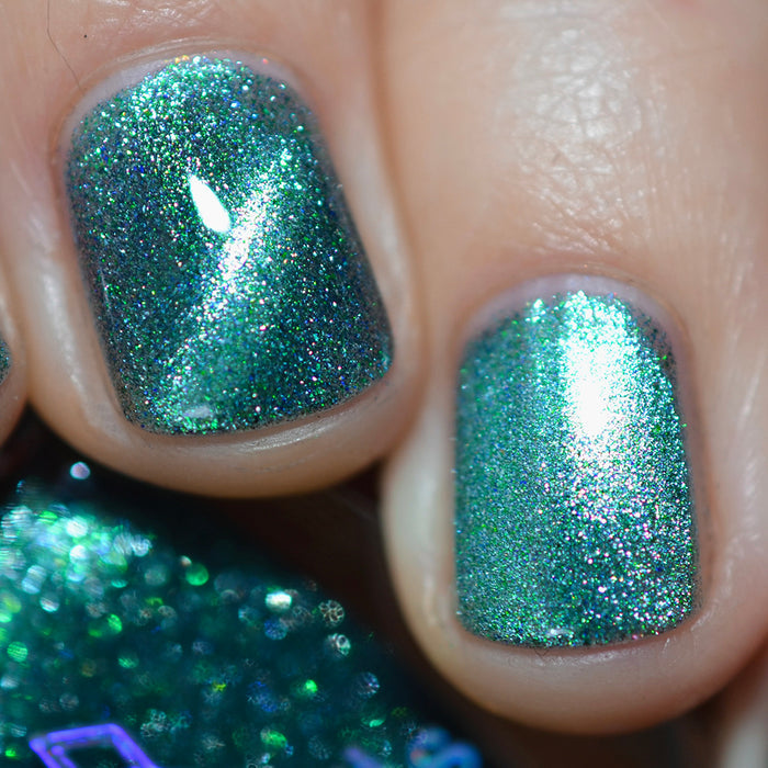 Close-up of two nails painted with Turquoise Silk Nail Lacquer.
