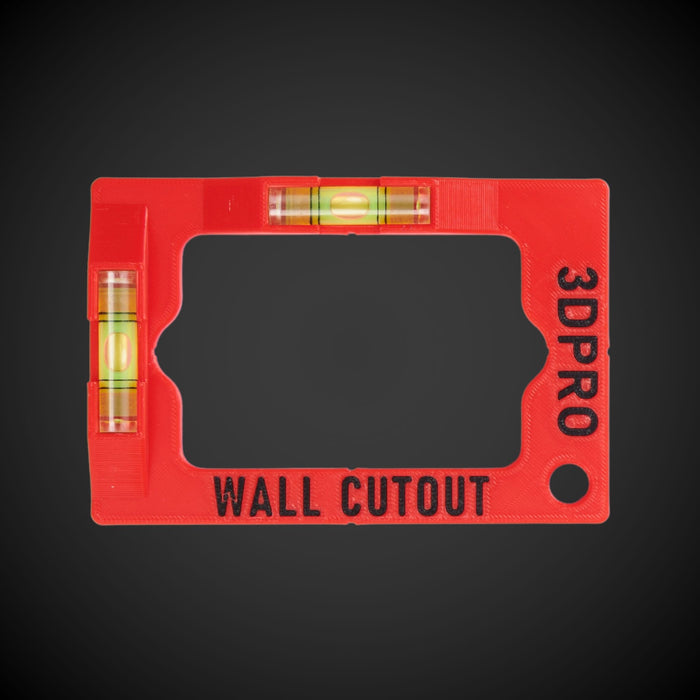A red and black wall cut out template tool with horizontal and vertical spirit levels, and space to attach with a carabiner.