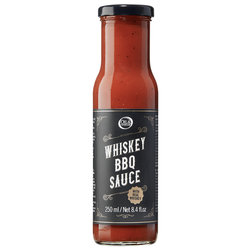 A bottle of Whiskey BBQ Sauce with a label showing the product name and volume.