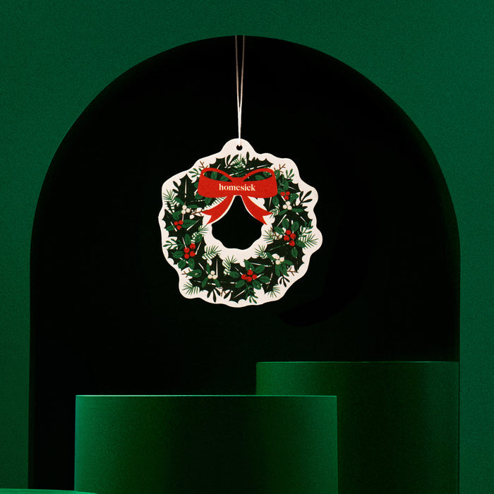 Car freshener on a green decorative background