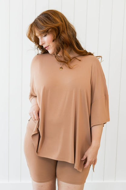 Female looking off to the side wearing the Women’s Biker Short Set in Latte