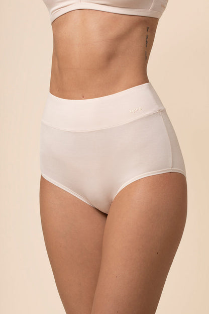 Off white high-waisted underwear worn by a person on a beige background
