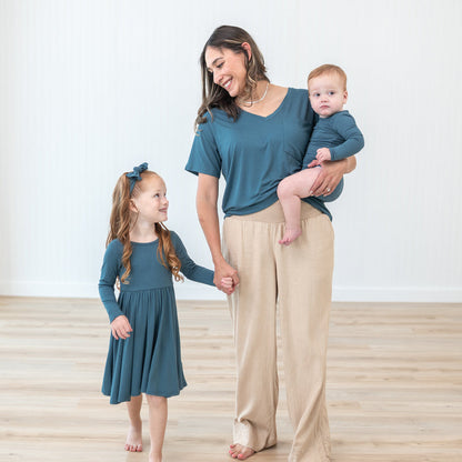 Family matching in Atlantic items. Pictures are the Women’s Relaxed Fit V-Neck in Atlantic, long sleeve twirl dress and long sleeve bodysuit