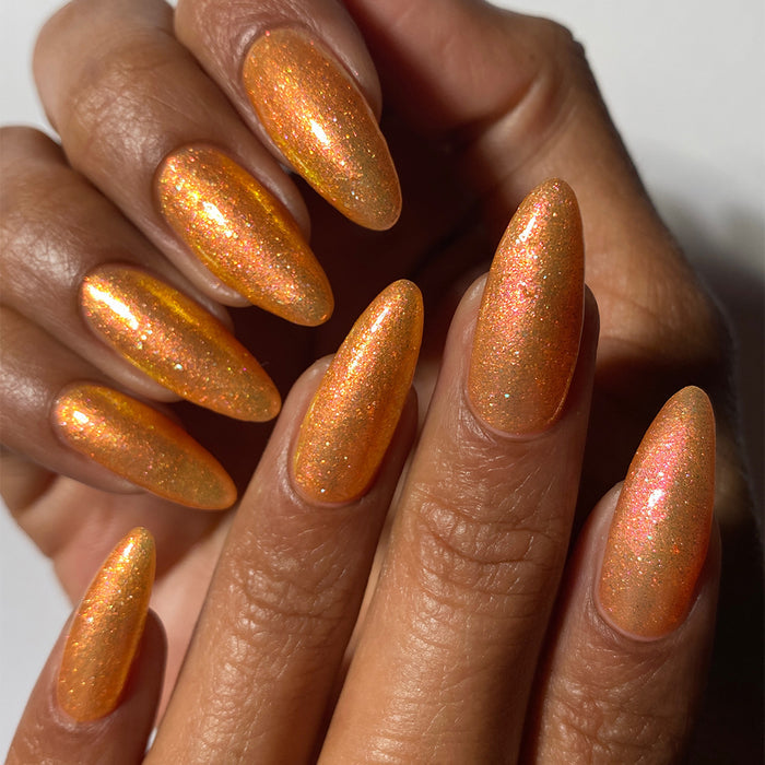 Close-up of nails painted with Yuzu Limonada Nail Lacquer on medium skin tone.